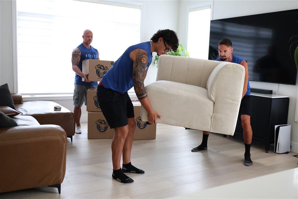 Macho Movers team carefully moving furniture