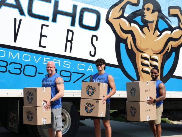 Local movers in Oakville Ontario loading furniture and moving boxes into a moving truck